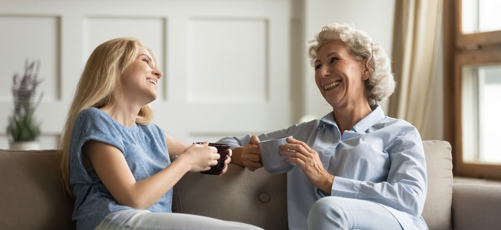 mother and daughter talking and laughing